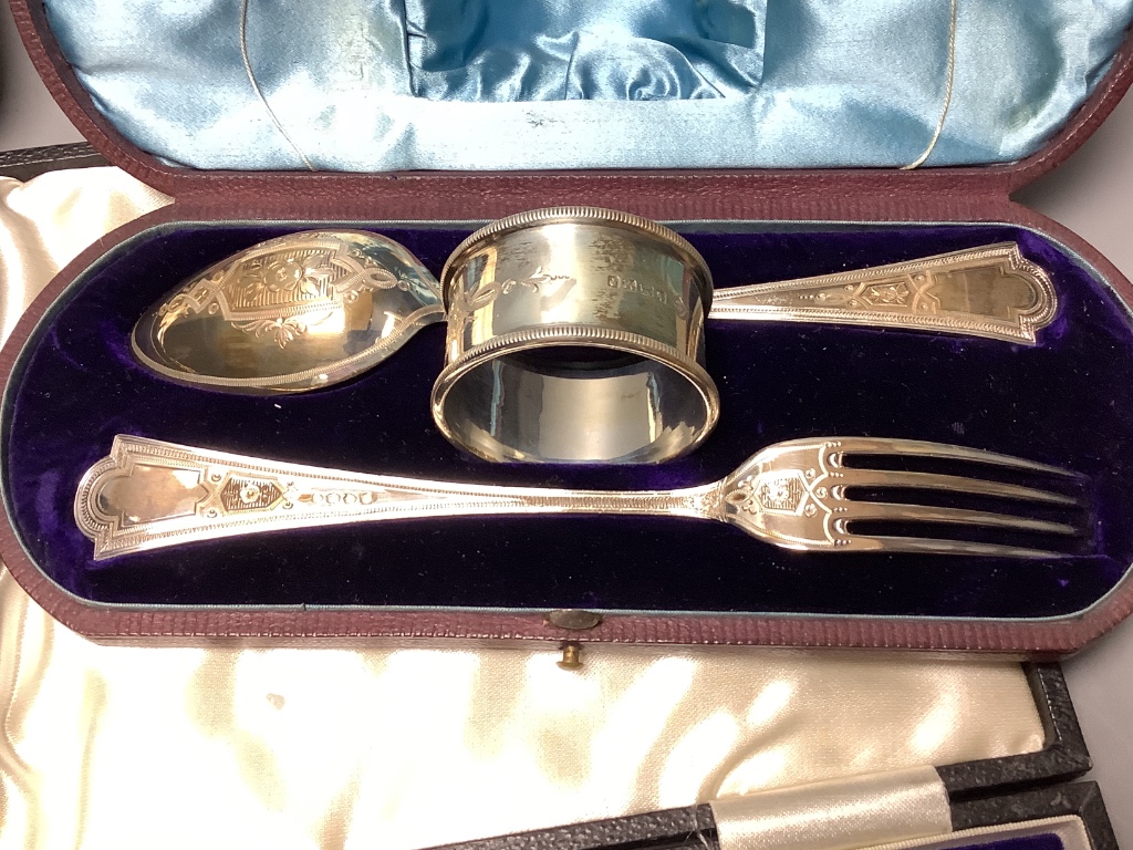 A cased Victorian silver christening trio, Martin, Hall & Co, Sheffield & London, 1879 and two other cased sets of silver teaspoons (6 & 12).